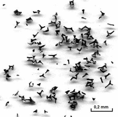 Loose particles of crushed glassy carbon (RVC) forming a porous electrochemical electrode structure.